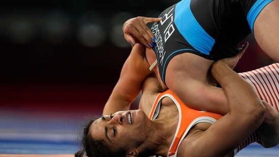 India's Vinesh Vinesh compete with Belarus' Vanesa Kaladzinskaya Tiako during the women's 53kg Freestyle wrestling eight final match at the 2020 Summer Olympics, Thursday, Aug. 5, 2021, in Tokyo, Japan. (AP Photo/Aaron Favila)(AP)