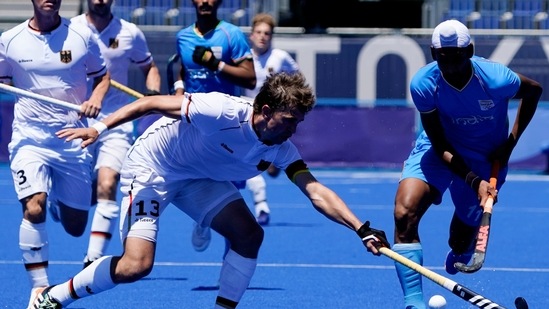 India's Mandeep Singh, right, drives against Germany's Tobias Constantin Hauke during the men's field hockey bronze medal match at the 2020 Summer Olympics, Thursday, Aug. 5, 2021, in Tokyo, Japan. (AP Photo/John Minchillo)(AP)