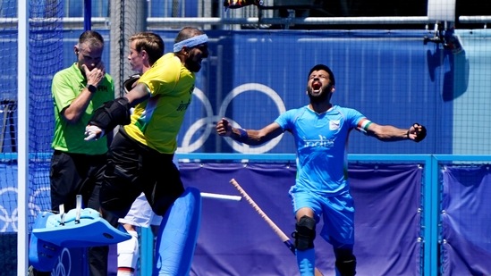 India goalkeeper Sreejesh Parattu Raveendran, left, and Manpreet Singh (7) react after making a save against Germany in the final seconds of the men's field hockey bronze medal match at the 2020 Summer Olympics, Thursday, Aug. 5, 2021, in Tokyo, Japan. (AP Photo/John Minchillo)(AP)