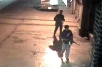 Closed circuit television footage shows gunmen walking across parking lot after shooting spree at Chhatrapati Shivaji Terminus train station in Mumbai. Closed circuit television footage shows gunmen walking across parking lot after shooting spree at Chhatrapati Shivaji Terminus train station in Mumbai.