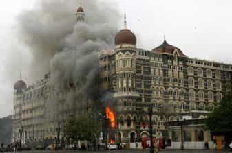 The Taj Mahal hotel is seen engulfed in smoke during a gunbattle in Mumbai. The Taj Mahal hotel is seen engulfed in smoke during a gunbattle in Mumbai.