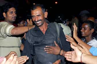 People congratulate an National Security Guard (NSG) commando as he leaves the Nariman House after an operation, in Mumbai.
</div) People congratulate an National Security Guard (NSG) commando as he leaves the Nariman House after an operation, in Mumbai.
</div)