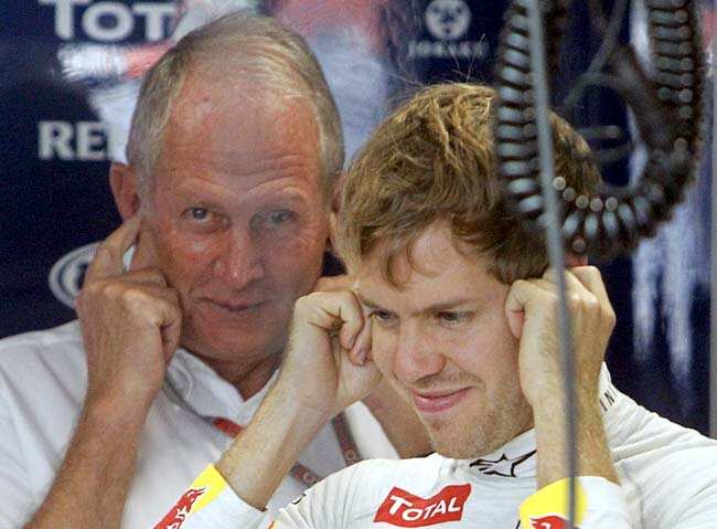Sebastian Vettel (R) and Red Bull advisor Helmut Marko cover their ears inside their team garage during the first practice session of the Indian GP at the Buddh International Circuit, Greater Noida. Reuters Photo
</div) Sebastian Vettel (R) and Red Bull advisor Helmut Marko cover their ears inside their team garage during the first practice session of the Indian GP at the Buddh International Circuit, Greater Noida. Reuters Photo
</div)