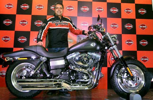 Anoop Prakash, managing director, Harley-Davidson India, poses with the Fat Bob motorcycle during its launch in New Delhi. (PTI Photo) Harley unveils new bike, eyes smaller towns