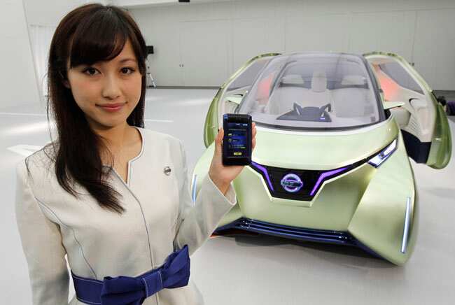 A model holds a smartphone as she poses with Nissan's new concept car PIVO3 at its unveiling ceremony for journalists at its technical center in Atsugi, south of Tokyo. Nissan's 8th EV concept car PIVO3 can be controlled and communicated with smartphones. REUTERS/Kim Kyung-Hoon Who needs a license? Self-driving cars coming our way