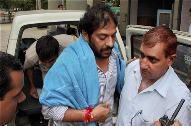 Delhi police along with former Haryana home minister Gopal Kanda raided the office of MDLR group in Gurgaon and seized documents and scanned various computers, related with Geetika Sharma's suicide case. PTI Delhi police along with former Haryana home minister Gopal Kanda raided the office of MDLR group in Gurgaon and seized documents and scanned various computers, related with Geetika Sharma's suicide case. PTI