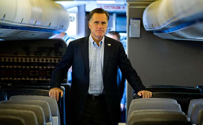 Mitt Romney answers a question after landing in Portsmouth.(AP Photo/Evan Vucci)
</div) Mitt Romney answers a question after landing in Portsmouth.(AP Photo/Evan Vucci)
</div)