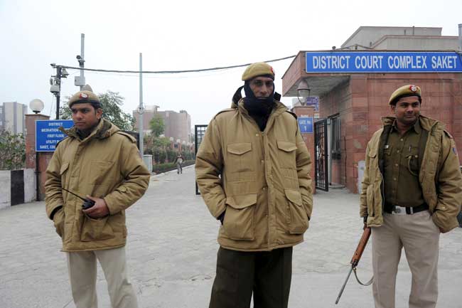Police personnel stand guard outside the district court Saket in New Delhi. AFP Photo Police personnel stand guard outside the district court Saket in New Delhi. AFP Photo