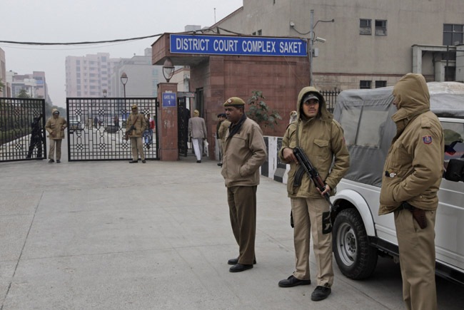 Police officers stand outside the district court where five gangrape accused were brought to appear in New Delhi. AP Photo/Manish Swarup Police officers stand outside the district court where five gangrape accused were brought to appear in New Delhi. AP Photo/Manish Swarup