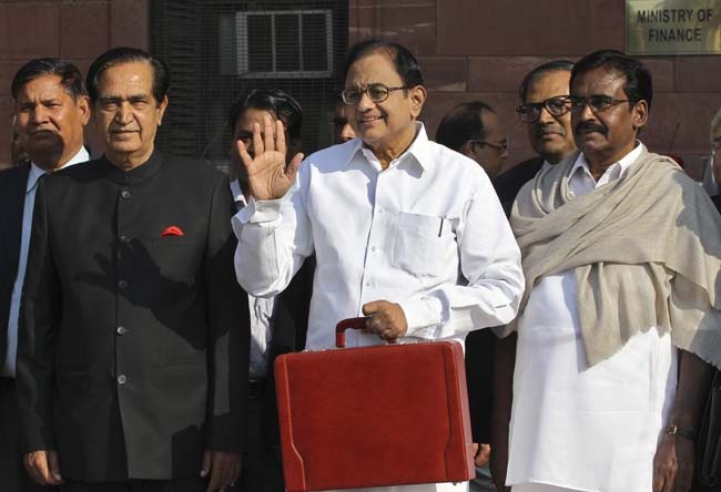 P Chidambaram leaving his office to present the 2013-14 Union Budget in New Delhi. Reuters P Chidambaram leaving his office to present the 2013-14 Union Budget in New Delhi. Reuters