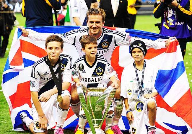 Romeo Beckham poses with signed Cristiano Ronaldo shirt as he joins dad  David Beckham to watch thrilling Arsenal win