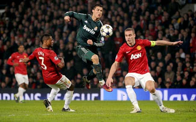 Manchester Uniteds Serbian defender Nemanja Vidic (R) blocks a shot from Real Madrids Portuguese forward Cristiano Ronaldo during match at Old Trafford in Manchester. (AFP)
</div) Manchester Uniteds Serbian defender Nemanja Vidic (R) blocks a shot from Real Madrids Portuguese forward Cristiano Ronaldo during match at Old Trafford in Manchester. (AFP)
</div)