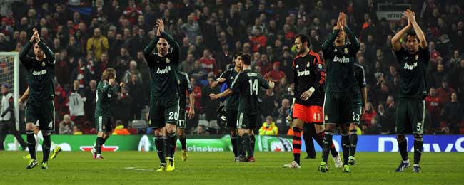 Real Madrid players winning the UEFA Champions League round of 16 second leg football match between Manchester United and Real Madrid at Old Trafford in Manchester, northwest England. (AFP)
</div) Real Madrid players winning the UEFA Champions League round of 16 second leg football match between Manchester United and Real Madrid at Old Trafford in Manchester, northwest England. (AFP)
</div)