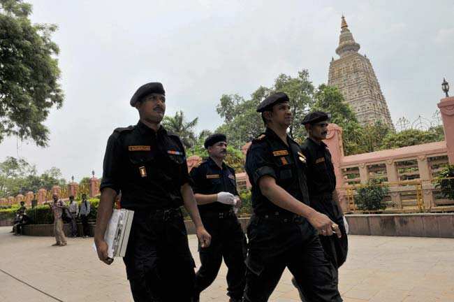 NSG experts at Mahabodhi Mahavihara in Bodh Gaya on July 8, 2013, a day after serial blasts rocked the temple. PTI Photo NSG experts at Mahabodhi Mahavihara in Bodh Gaya on July 8, 2013, a day after serial blasts rocked the temple. PTI Photo