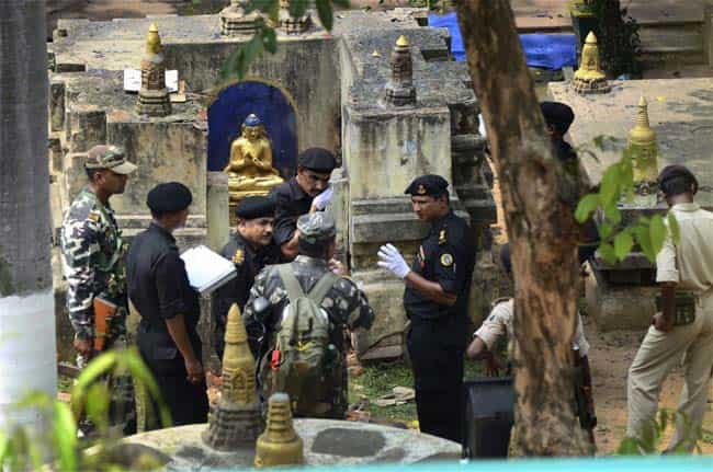 NSG and NIA experts at Mahabodhi Mahavihara in Bodh Gaya on Monday, a day after serial blasts in the temple. PTI Photo NSG and NIA experts at Mahabodhi Mahavihara in Bodh Gaya on Monday, a day after serial blasts in the temple. PTI Photo