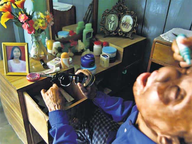 Haseena Hussain was a bright-eyed computer professional (earlier pic on her table) but she has since lost her sight. (AP Photo) Haseena Hussain was a bright-eyed computer professional (earlier pic on her table) but she has since lost her sight. (AP Photo)