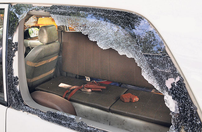 The broken rear glass of the PCR van allegedly by pelted stones. (Photo by Sushil Kumar/Hindustan Times)
</div) The broken rear glass of the PCR van allegedly by pelted stones. (Photo by Sushil Kumar/Hindustan Times)
</div)