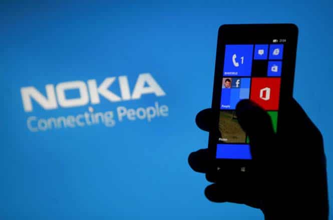 A woman poses with a Nokia Lumia smartphone. (Reuters) A woman poses with a Nokia Lumia smartphone. (Reuters)