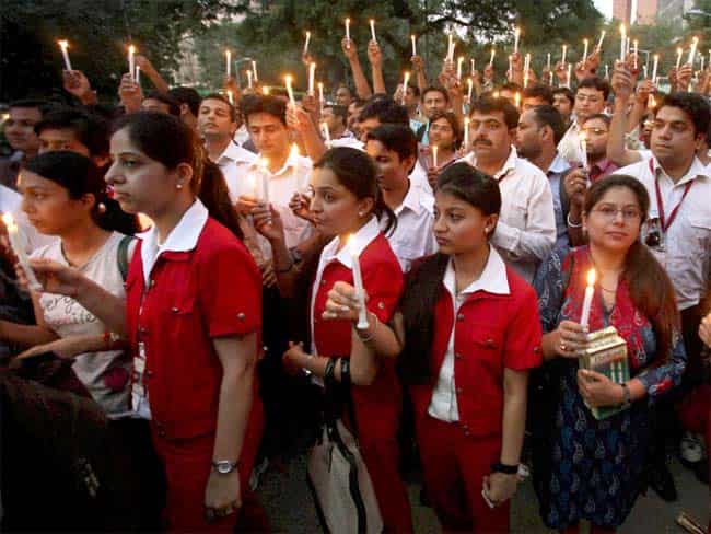 Kingfisher employees take part in a candle march at Jantar Mantar in New Delhi. PTI Photo Kingfisher employees take part in a candle march at Jantar Mantar in New Delhi. PTI Photo