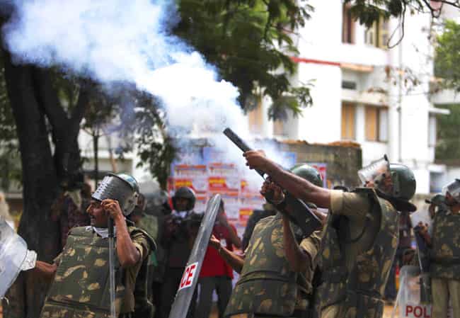 Police fire tear gas shells at students during a protest demanding the creation of a new state named Telangana in Hyderabad. AP Photo Police fire tear gas shells at students during a protest demanding the creation of a new state named Telangana in Hyderabad. AP Photo