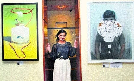 Dia poses for the photographers at the Art Show hosted by her in Mumbai Dia poses for the photographers at the Art Show hosted by her in Mumbai