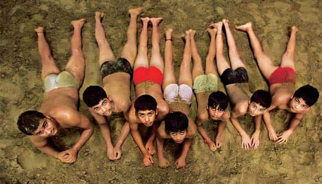 Sons of the soil: Their idea of recreation is mud bouts: trainees at Chhatrasal Stadium Sons of the soil: Their idea of recreation is mud bouts: trainees at Chhatrasal Stadium