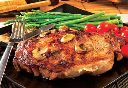 The little specks of marbled fat on a steak are what give it taste. Fat imparts flavour to food