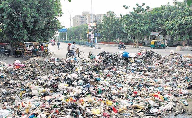 The garbage from the dumpyard in front of Queen Mary School in Mayur Vihar Phase 1. Residents say the sanitation workers do not lift the garbage for weeks altogether, which results in this stockpile in front of their homes. The garbage from the dumpyard in front of Queen Mary School in Mayur Vihar Phase 1. Residents say the sanitation workers do not lift the garbage for weeks altogether, which results in this stockpile in front of their homes.