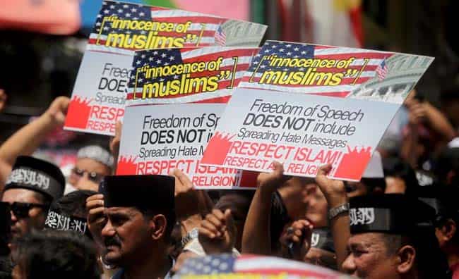 Malaysian Muslims hold placards and shout anti-American slogans during a protest against the low-budget US film the 'Innocence of Muslims' and the cartoon of Prophet Mohammad in a French weekly in Kuala Lumpur. AFP Malaysian Muslims hold placards and shout anti-American slogans during a protest against the low-budget US film the 'Innocence of Muslims' and the cartoon of Prophet Mohammad in a French weekly in Kuala Lumpur. AFP