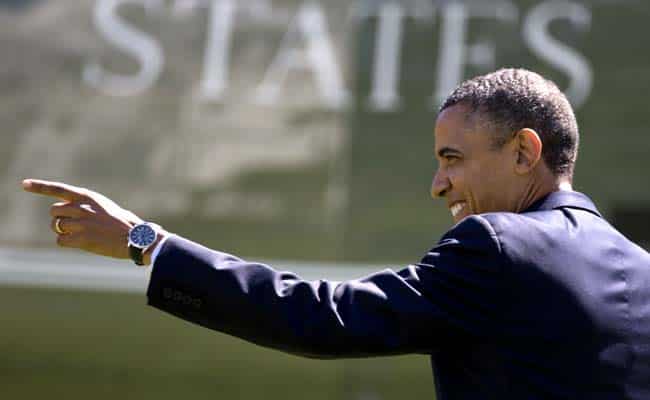 US President Barack Obama point to people on the South Lawn of the White House in Washington. AP Photo/Carolyn Kaster