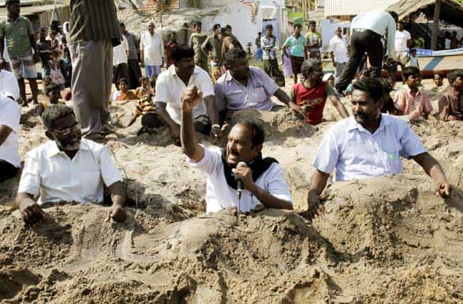 MDMK General Secretary Vaiko half buried in sand addressing PMANE activists during the protest demonstration against KKNPP, in Idinthakarai. Agencies