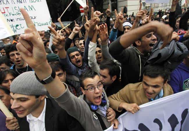 Activists of Islamic groups protest against an anti-Muslim film near the US embassy in Vienna, Austria on Saturday. (AP Photo/Ronald Zak) (AP Photo/Fareed Khan) Activists of Islamic groups protest against an anti-Muslim film near the US embassy in Vienna, Austria on Saturday. (AP Photo/Ronald Zak) (AP Photo/Fareed Khan)
