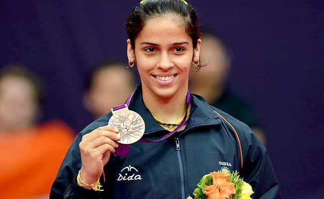 Saina Nehwal poses with her bronze medal after beating China's Wang Xin in their bronze medal women's singles badminton match at the London 2012 Olympic Games. AFP