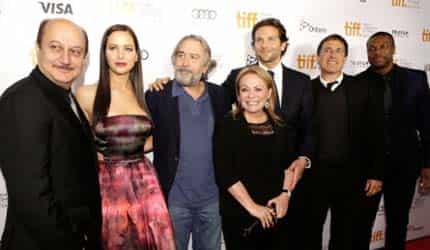 Anupam Kher (L) and Bradley Cooper (3rd from R) at the screening of Silver Lining Playbook 
</div)