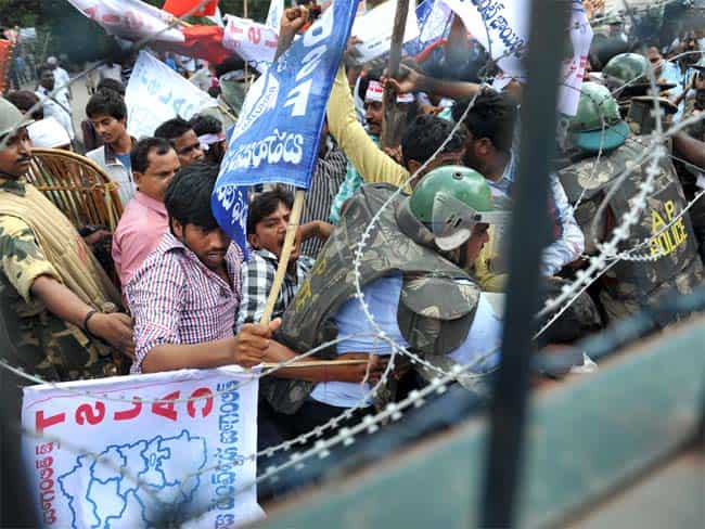 Police clash with members of the Telangana Students Joint Action Committe as they prevent students from marching during a protest rally held to demand the separate Telangana state at the Osmania University. AFP