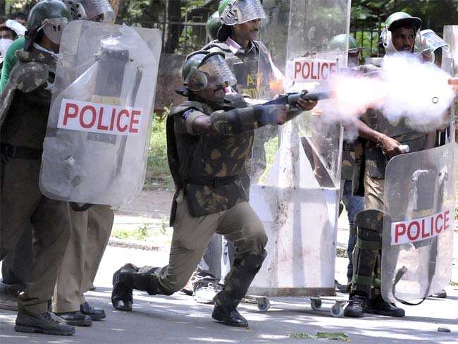 Police fire tear gas at members of the Telangana Students Joint Action Committee as they prevent the students from marching during a protest rally held to demand the separate Telangana state at the Osmania University. AFP