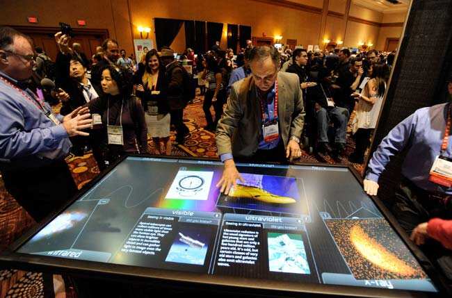 Diego Romeu of 3M Touch Systems uses an 84 inch touch table during a press event at the Mandalay Bay Convention Center for the 2013 International CES on January 6, 2013 in Las Vegas, Nevada. CES, the world's largest annual consumer technology trade show, runs from January 8-11 and is expected to feature 3,100 exhibitors showing off their latest products and services to about 150,000 attendees. David Becker/Getty Images/AFP Diego Romeu of 3M Touch Systems uses an 84 inch touch table during a press event at the Mandalay Bay Convention Center for the 2013 International CES on January 6, 2013 in Las Vegas, Nevada. CES, the world's largest annual consumer technology trade show, runs from January 8-11 and is expected to feature 3,100 exhibitors showing off their latest products and services to about 150,000 attendees. David Becker/Getty Images/AFP