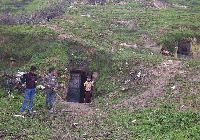 Boys play outside their shelter in a cave near Hama December 24, 2012. Picture taken December 24, 2012. Reuters/Samer Al-Hamwi/Shaam News Network/Handout Boys play outside their shelter in a cave near Hama December 24, 2012. Picture taken December 24, 2012. Reuters/Samer Al-Hamwi/Shaam News Network/Handout