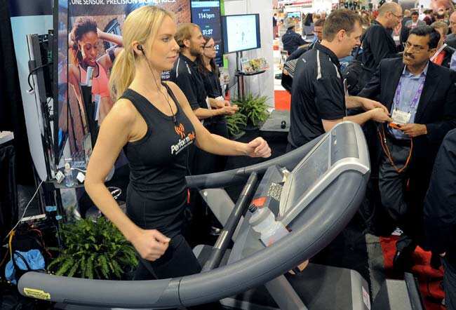 Woman works out while her pulse and callories are monitored by PerformTech earbuds made by Valencell at the Las Vegas Convention Center on January 9, 2013 in Las Vegas, Nevada. CES, the world's largest annual consumer technology trade show, runs from January 8-11 and is expected to feature 3,100 exhibitors showing off their latest products and services to about 150,000 attendees. Photo: AFP / Joe Klamar Woman works out while her pulse and callories are monitored by PerformTech earbuds made by Valencell at the Las Vegas Convention Center on January 9, 2013 in Las Vegas, Nevada. CES, the world's largest annual consumer technology trade show, runs from January 8-11 and is expected to feature 3,100 exhibitors showing off their latest products and services to about 150,000 attendees. Photo: AFP / Joe Klamar