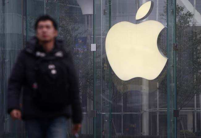 A man walks in front of a company logo outside an Apple store in downtown Shanghai January 24, 2013. Photo: Reuters/Aly Song A man walks in front of a company logo outside an Apple store in downtown Shanghai January 24, 2013. Photo: Reuters/Aly Song