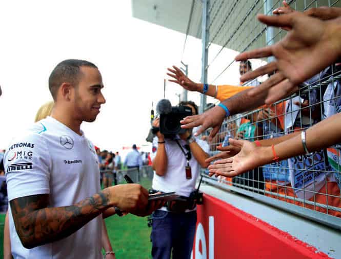 Hamilton signs autographs at the Buddh International Circuit in Noida Hamilton signs autographs at the Buddh International Circuit in Noida