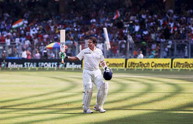 Sachin Tendulkar acknowledges the affection and support of spectators as he walks off the field after his dismissal on Day 2 of the final Test match against West Indies at Wankhede Stadium in Mumbai. (PTI Photo) Sachin Tendulkar acknowledges the affection and support of spectators as he walks off the field after his dismissal on Day 2 of the final Test match against West Indies at Wankhede Stadium in Mumbai. (PTI Photo)