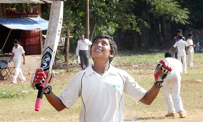 15 year-old Prithvi Shaw celebrates after scoring 500 runs at a Harris Shield match in Mumbai. Shaw slammed 546 runs to break Armaan Jaffer's Harris Shield record of 498 runs. (PTI Photo)
</div) 15 year-old Prithvi Shaw celebrates after scoring 500 runs at a Harris Shield match in Mumbai. Shaw slammed 546 runs to break Armaan Jaffer's Harris Shield record of 498 runs. (PTI Photo)
</div)