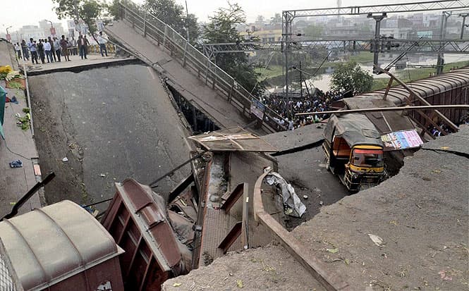 A portion of a flyover collapsed on a stationary goods train in Muzaffarpur. (PTI photo)
</div) A portion of a flyover collapsed on a stationary goods train in Muzaffarpur. (PTI photo)
</div)