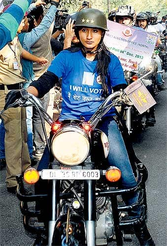 A young volunteer rides a bike at a rally to raise awareness among voters to exercise their franchise. The event was organised by a district electoral office. (Sushil Kumar/ HT Photo)</em></strong>
</div) A young volunteer rides a bike at a rally to raise awareness among voters to exercise their franchise. The event was organised by a district electoral office. (Sushil Kumar/ HT Photo)</em></strong>
</div)