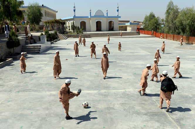 Afghan orphans play football in the yard of the Shiekh Zayed orphanage in Kandahar. (AFP Photo)
</div) Afghan orphans play football in the yard of the Shiekh Zayed orphanage in Kandahar. (AFP Photo)
</div)