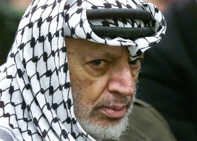 In this May 31, 2002 file photo, Palestinian leader Yasser Arafat pauses during the weekly Muslim Friday prayers in his headquarters in the West Bank city of Ramallah. (AP Photo) 
</div)