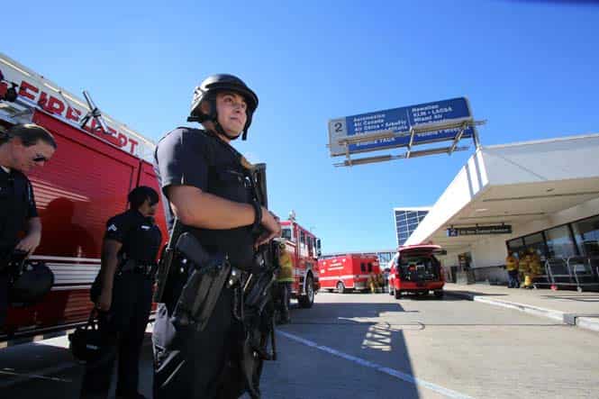 Police stand guard outside Terminal 2 at Los Angeles International Airport after a gunman armed with a semi-automatic rifle opened fire inside the Los Angeles International Airport. (AP Photo) Police stand guard outside Terminal 2 at Los Angeles International Airport after a gunman armed with a semi-automatic rifle opened fire inside the Los Angeles International Airport. (AP Photo)