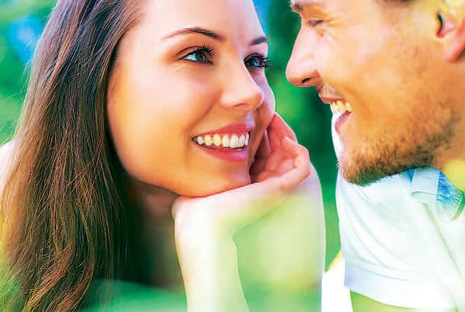 Private moment: Lovers position themselves strategically behind bushes or tree trunks looking to create a moment of intimacy for themselves Private moment: Lovers position themselves strategically behind bushes or tree trunks looking to create a moment of intimacy for themselves