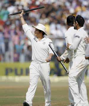 Sachin carries a stump as he walks out of the ground at Wankhede. (PTI)
</div) Sachin carries a stump as he walks out of the ground at Wankhede. (PTI)
</div)